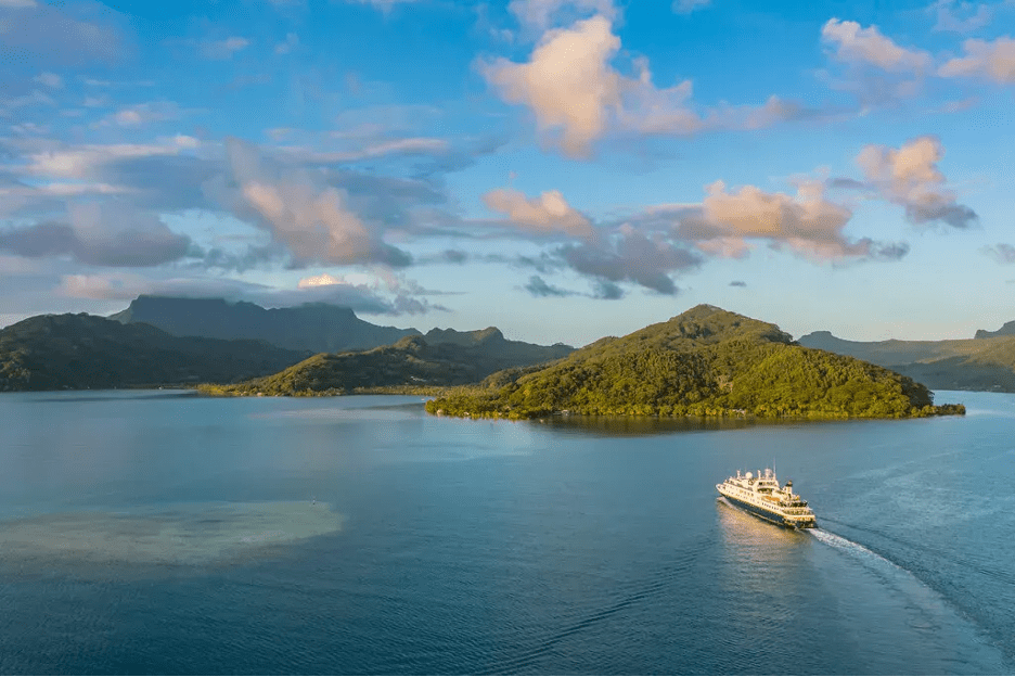 cruiseship with mountains in background