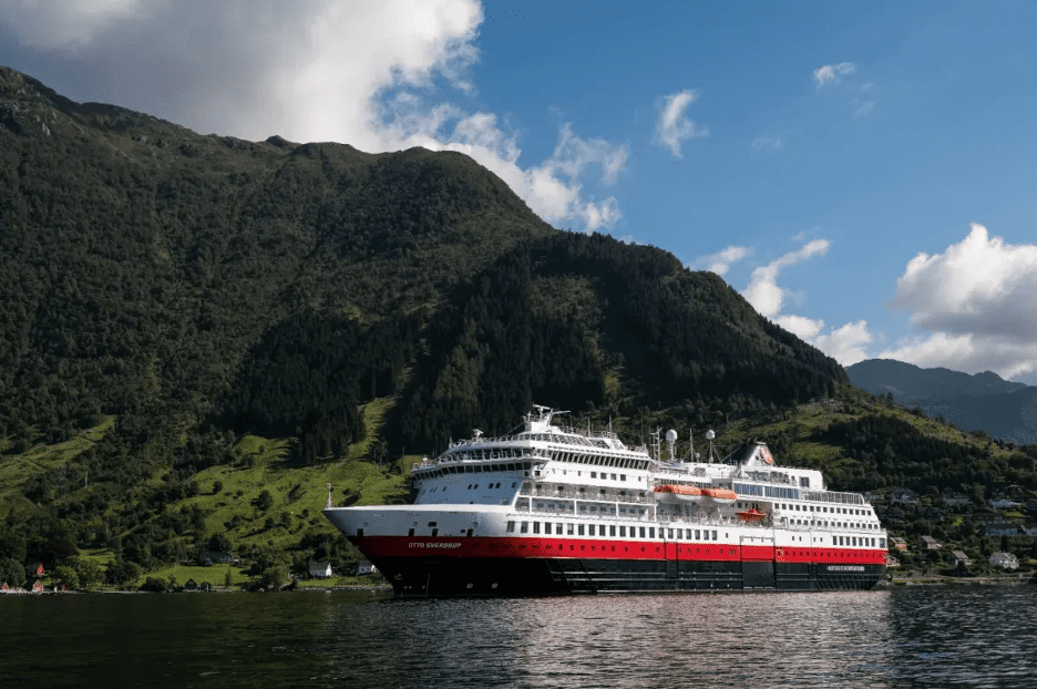 Cruise ship with mountain in background